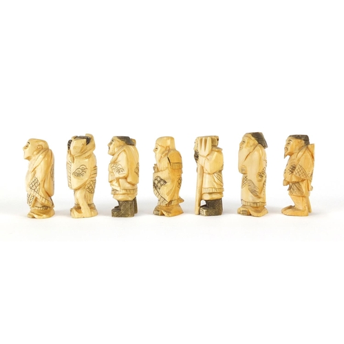 323 - Seven Japanese carved ivory Okimono's including two of farmers, one with character marks to the base... 