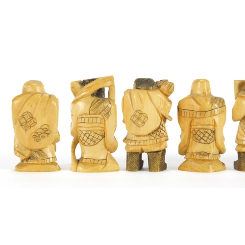 323 - Seven Japanese carved ivory Okimono's including two of farmers, one with character marks to the base... 