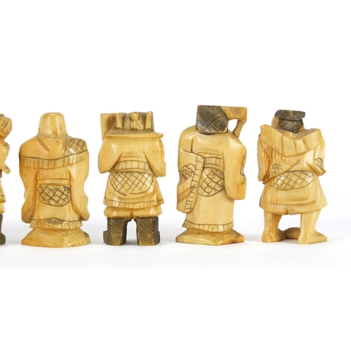 323 - Seven Japanese carved ivory Okimono's including two of farmers, one with character marks to the base... 