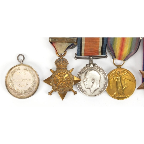 135 - British Military World War I and World War II medal group and a silver medallion including a trio aw... 