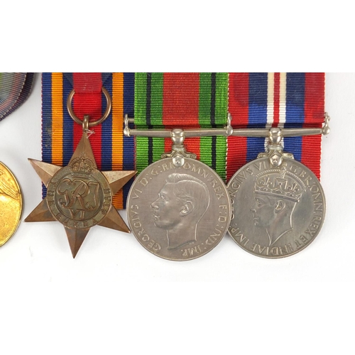 135 - British Military World War I and World War II medal group and a silver medallion including a trio aw... 