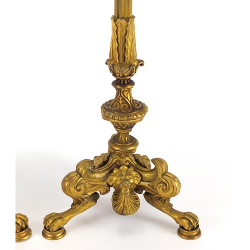 2 - Pair of 19th century ormolu candlesticks with reeded columns, lion masks and claw feet, each 34.5cm ... 