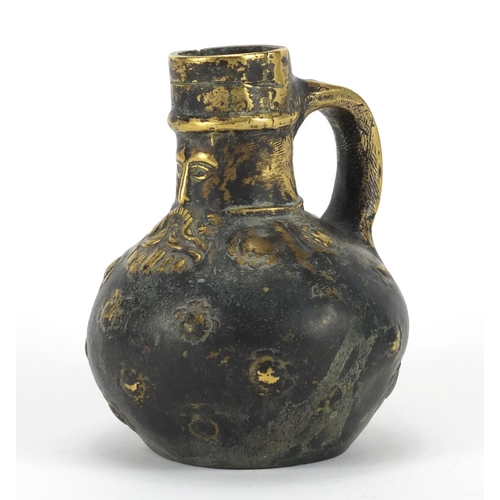 9 - Bronze bellarmine jug with mask dated 1607, 12.5cm high