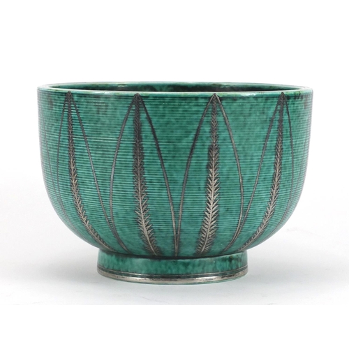 486 - Swedish art pottery bowl by Gustavsberg with silver inlay, decorated with stylised leaves, factory m... 