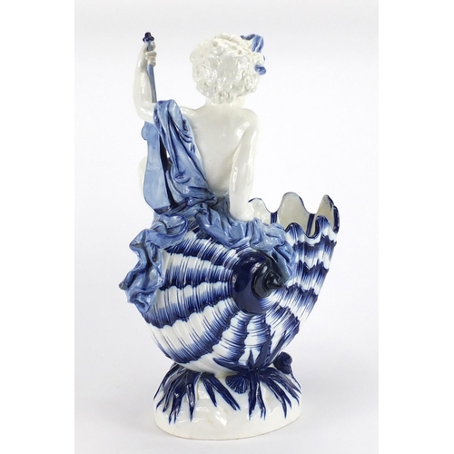 416 - Large Victorian nautilus shell centre piece by Minton mounted with a semi nude young boy, impressed ... 