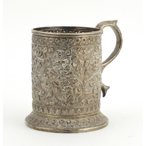554 - Middle Eastern unmarked silver tankard profusely embossed with flowers, engraved Souvenir de Maugo E... 