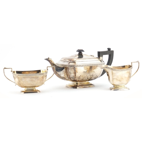 528 - Silver three piece tea set, by John Taylor & Co, Birmingham 1938, the teapot 30cm in length, approxi... 