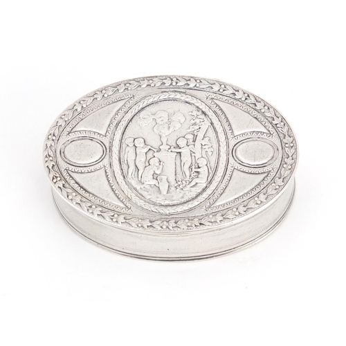 542 - Continental silver oval snuff box, the hinged lid embossed with putti, indistinct mark to the lid, 5... 