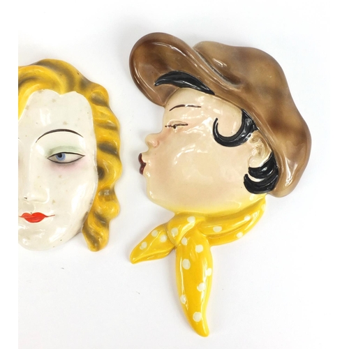 467 - Art Deco hand painted face mask of a female and a pair of Flacon Ware examples, the largest 24cm hig... 