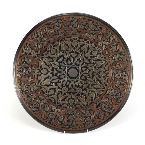 354 - Egyptian Cairo Ware copper wall charger with silver foliate inlay, 40.5cm in diameter