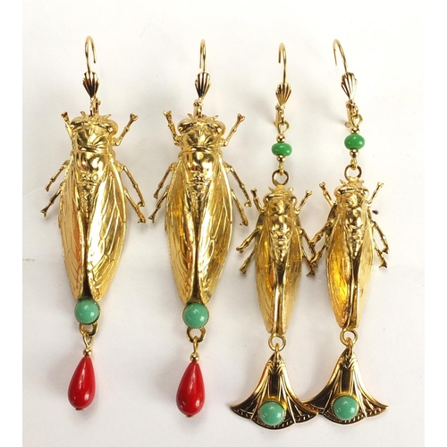 510 - Two pairs of Egyptian Revival gilt metal locust design earrings with drops, the largest pair 9cm hig... 