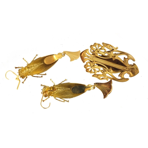 509 - Pair of Egyptian Revival gilt metal locust design earrings with drops and a pendant, 9cm high
