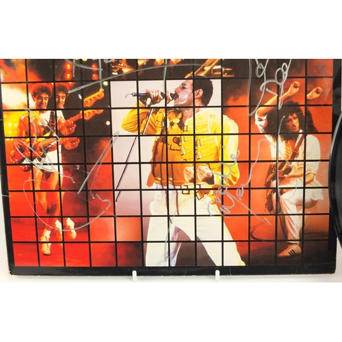 107 - Queen Live Magic vinyl, the sleeve signed by Freddie Mercury, Roger Taylor, John Deacon and Brian Ma... 