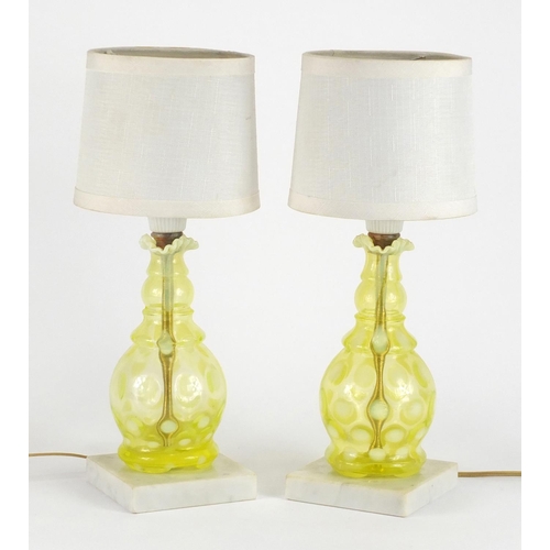 441 - Pair of Fenton Vaseline glass lamp bases with shades, each 34cm high