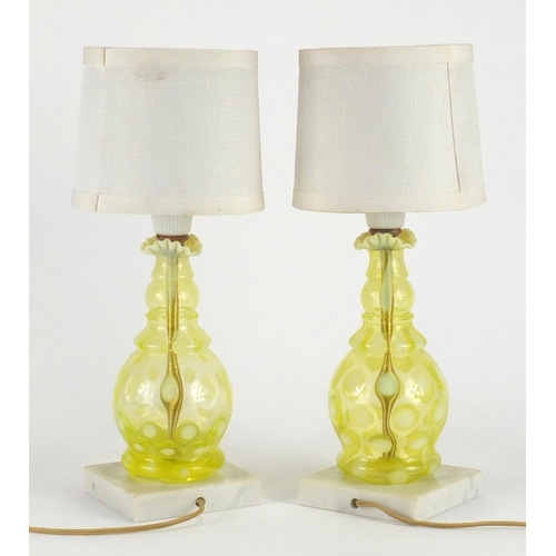 441 - Pair of Fenton Vaseline glass lamp bases with shades, each 34cm high