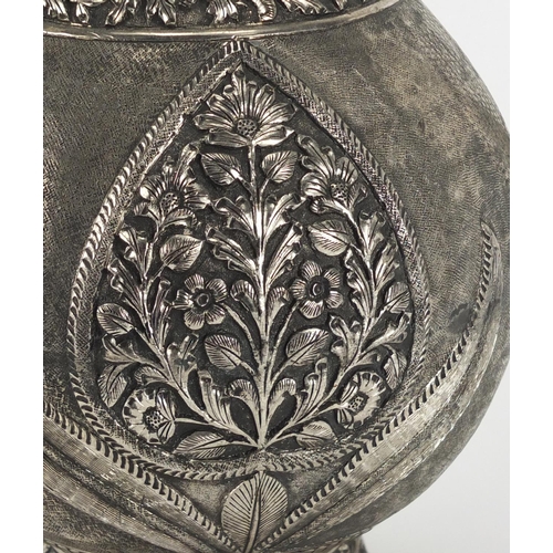369 - Indian silver coloured metal water jug cast with stylised flowers, 35.5cm high, approximate weight 1... 