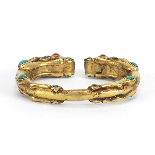 358 - Tibetan gilt metal dragon bangle set with turquoise and coral, 8cm wide