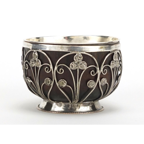 379 - Unmarked silver coconut footed bowl, set with miniature Middle Eastern coins, 5.5cm high