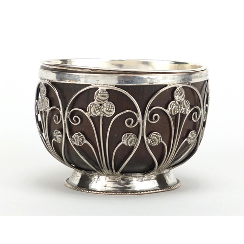 379 - Unmarked silver coconut footed bowl, set with miniature Middle Eastern coins, 5.5cm high