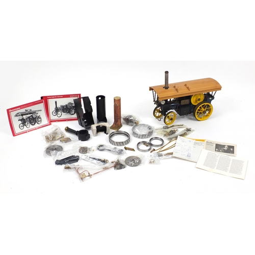 102 - Fareham Engineering Co one inch scale traction engine, with accessories and parts, 52cm in length