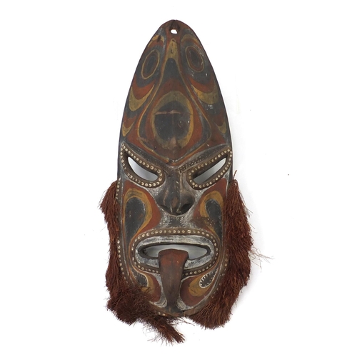 338 - Large Papua New Guinea carved wood face mask, hand painted with tribal motifs, 72cm high