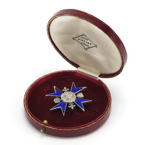 44 - Florence Nightingale School of Nursing silver and enamel badge, with silk and velvet lined tool leat... 