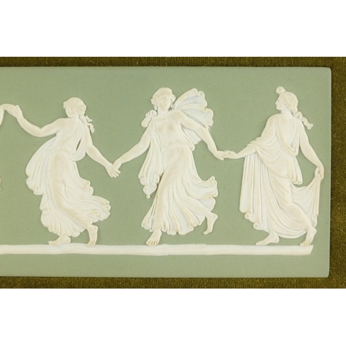 413 - Wedgwood green Jasper Ware dancing hours plaque, housed in a gilt frame, impressed marks to the reve... 