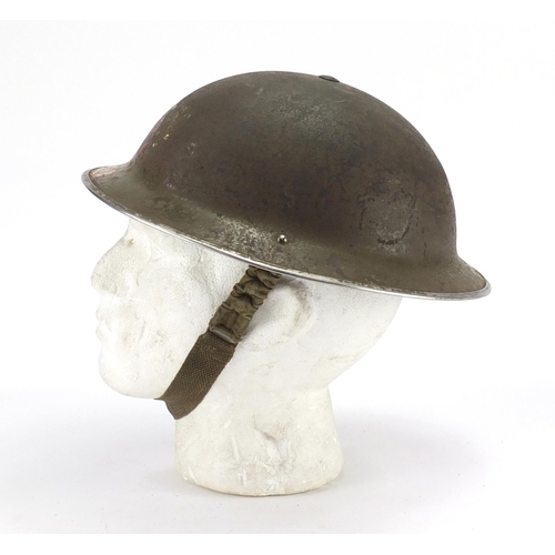 157 - British Military World War II NFC steel helmet with decals and leather liner, dated 1939
