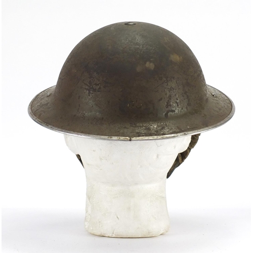 157 - British Military World War II NFC steel helmet with decals and leather liner, dated 1939