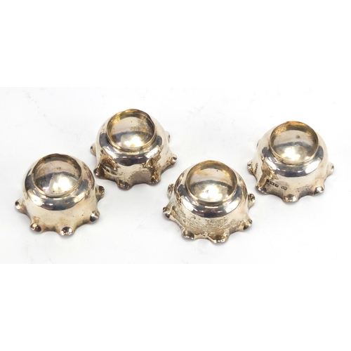 575 - Set of four circular silver open salts with spoons, by Atkin Brothers Sheffield 1902, housed in a fi... 