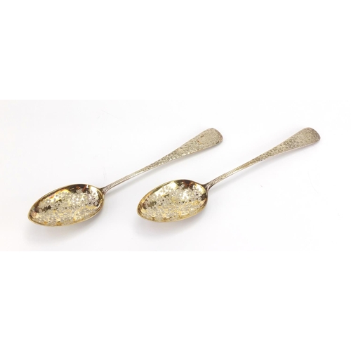 562 - Pair of Victorian silver serving spoons engraved with flowers and gilt bowls, by George Whiting Lond... 