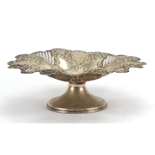 519 - Circular silver pedestal dish pierced and embossed with flowers and berries, by Harrison Fisher Shef... 