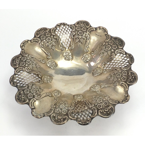 519 - Circular silver pedestal dish pierced and embossed with flowers and berries, by Harrison Fisher Shef... 