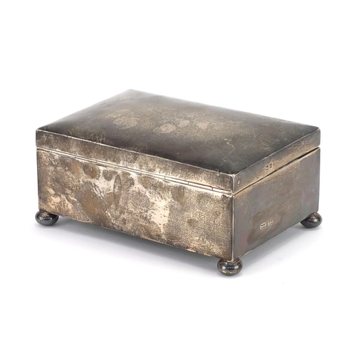 531 - Rectangular silver lockable casket with ball feet and silk lined interior, by Walker & Hall, 15.5cm ... 