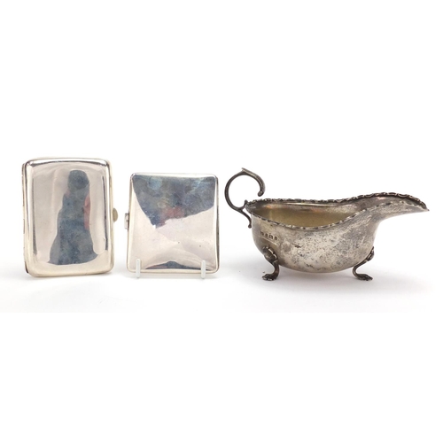 560 - Silver three footed sauce boat and two rectangular silver cigarette cases, various hallmarks, the sa... 