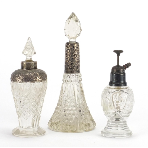 576 - Three Victorian cut glass scent bottles with silver mounts, various hallmarks, the largest 19.5cm hi... 