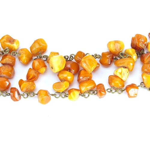 662 - Butterscotch amber coloured necklace and a bracelet, the necklace 50cm in length, approximate weight... 