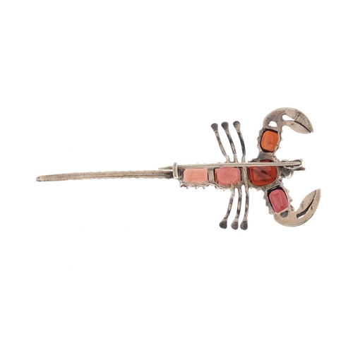 647 - Unmarked silver and garnet scorpion brooch, 6.5cm in length, approximate weight 6.3g, housed in a Vi... 