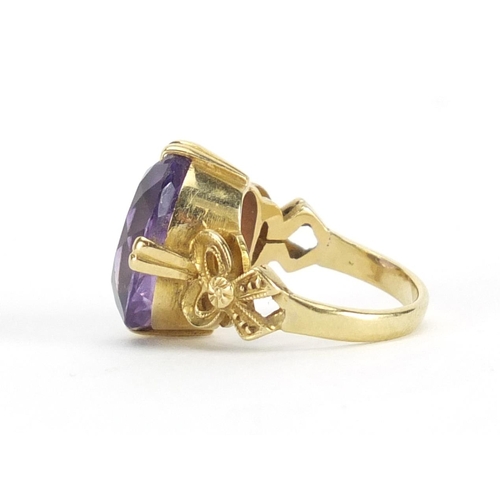 602 - 18ct gold amethyst solitaire ring, with bow design shoulders, size F, approximate weight 6.0g