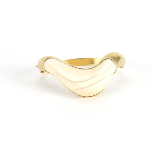 626 - 1970's modernist unmarked gold and ivory bangle, (tests as 18ct), 7cm wide, approximate weight 52.4g