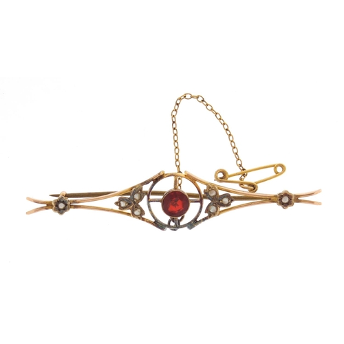 604 - Art Nouveau 9ct gold seed pearl and garnet bar brooch, 6.5cm in length, approximate weight 3.9g, hou... 