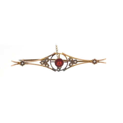 604 - Art Nouveau 9ct gold seed pearl and garnet bar brooch, 6.5cm in length, approximate weight 3.9g, hou... 