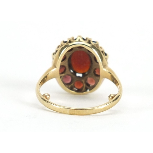 645 - 9ct gold cabochon garnet cluster ring, size L, approximate weight 3.9g