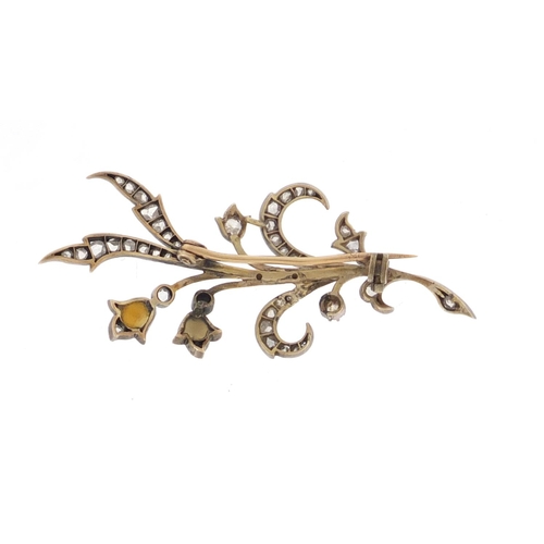 595 - Unmarked white metal diamond and pearl floral spray brooch, 5.5cm in length, approximate weight 4.6g