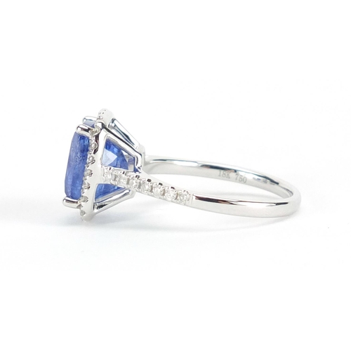 611 - 18ct white gold tanzanite and diamond ring, size N, approximate weight 4.6g