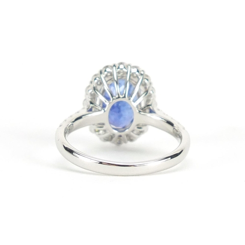 632 - 18ct white gold tanzanite and diamond ring, size N, approximate weight 4.7g