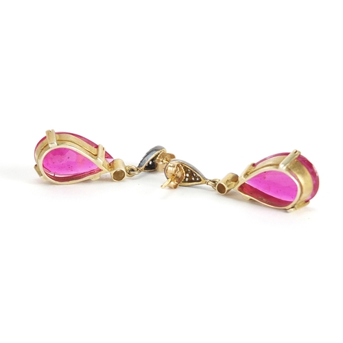 600 - Pair of 14ct gold ruby and diamond tear drop earrings, 3.5cm in length, approximate weight 7.5g