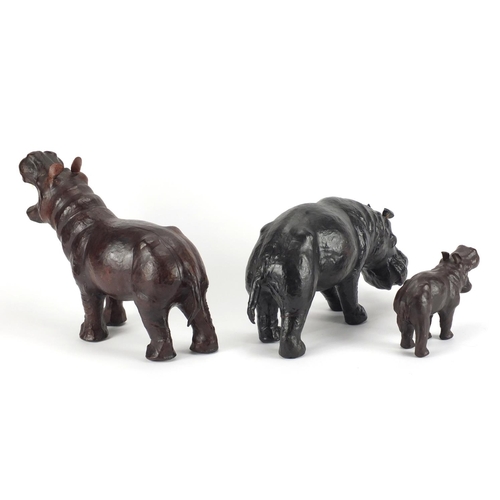 2423 - Three leather bound animals including two hippopotamus's