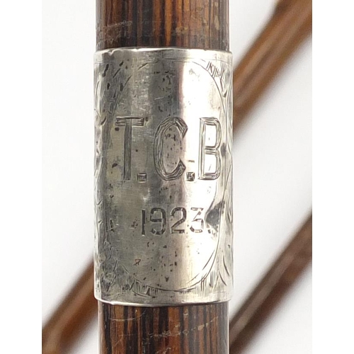 2491 - Three walking sticks with silver mounts, various hallmarks, the largest 90.5cm in length