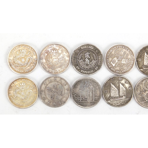 2576 - Twelve Chinese silver coloured metal coins including Queen Victoria design example